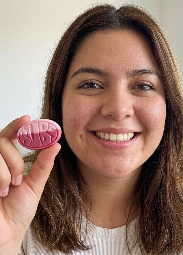 Customer taste testing Red 40 free BUBS Swedish candy from Sweedies.